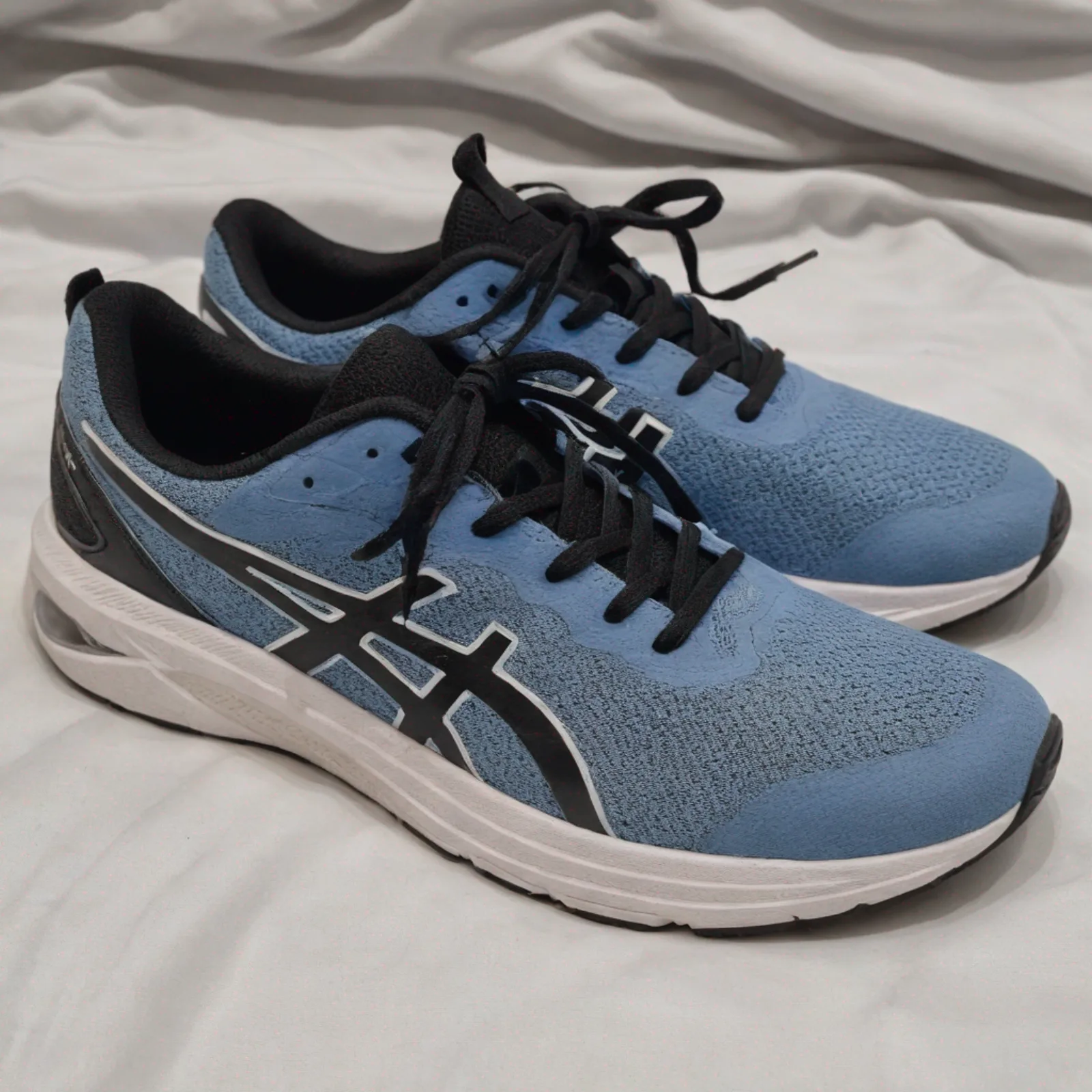 Generated image showing someone wearing the trainers in a puddle