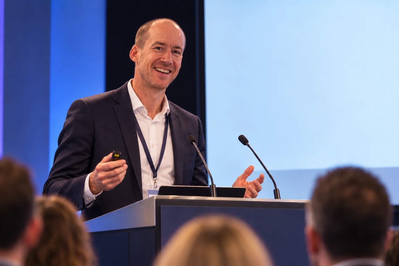 Dr Matthew Ryan presenting on stage at a conference